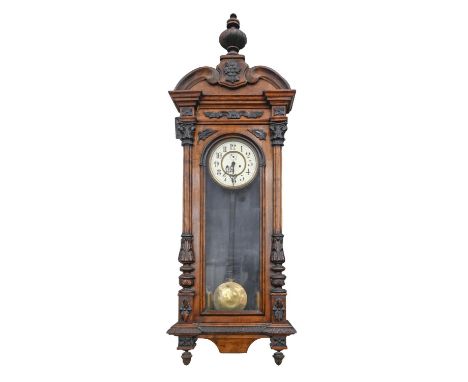 A walnut Vienna wall clock, c1900, with primrose enamel dial, pendulum and weights, 132cm h and a smaller ebonised Vienna wal
