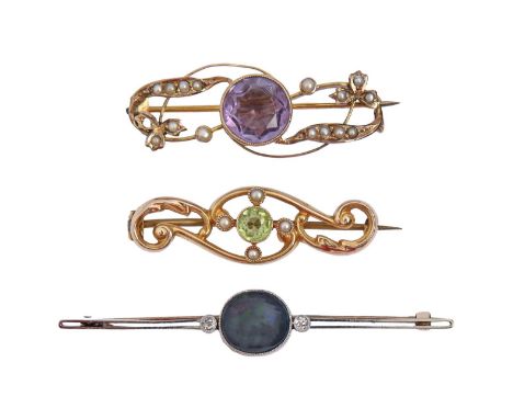 A peridot and seed pearl brooch, in 15ct gold, 37mm l, Chester 1911, 2.2g, a black opal diamond bar brooch, in gold marked 15