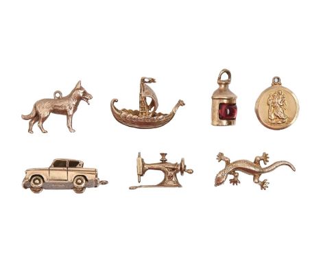 Seven 9ct gold charms, to include a motor car, ship's lamp, sewing machine and lizard, various sizes, 21g  Good condition