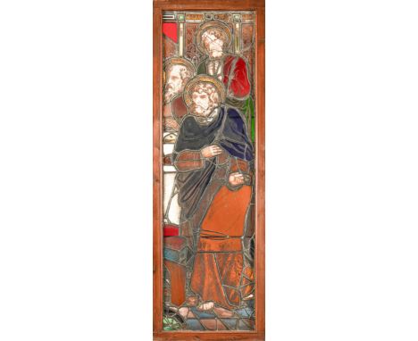 A Victorian stained glass window light of three saints, 188 x 61.5cm including wood frame  Several elements damaged but witho