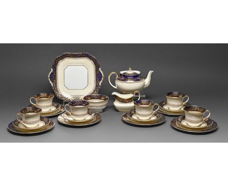 An Aynsley tea service, c1930, with cobalt and gilt border, two handled plate 25.5cm w, printed mark (19)  Teapot - cracked, 