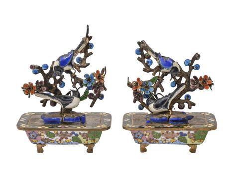 A pair of Japanese miniature giltmetal and enamel birds in bonsai, 20th c, 95mm h  In substantially good condition and decora