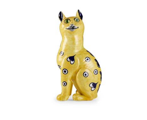 A LARGE WEMYSS WARE CAT  CIRCA 1900 covered in a yellow glaze with painted blue on white decoration, with applied green glass