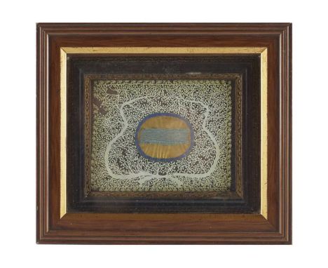 JACOBITE INTEREST - A FRAMED PIECE OF BLUE RIBBON CONTAINED WITHIN A FRAME, SURROUNDED BY A DECORATIVE FOLIATE CUT PAPER DESI
