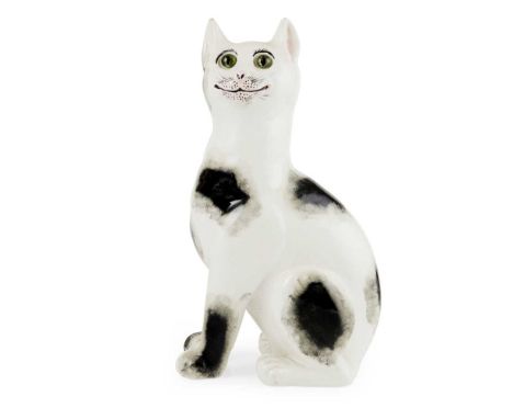 A LARGE WEMYSS WARE CAT CIRCA 1900 sponged black on white with applied green glass eyes, impressed WEMYSS WARE/ R.H.&amp;S., 