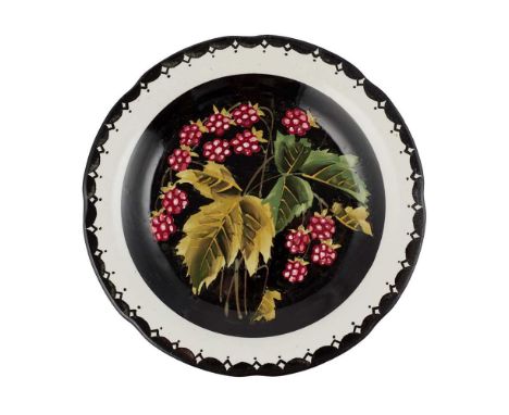 A WEMYSS WARE GORDON PLATE 'RASPBERRIES' PATTERN, EARLY 20TH  CENTURY decorated by Edwin Sandland on a black ground, painted 