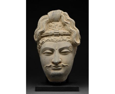 Ca. 200-300 AD A remarkable example of Kushan artistry, richly carved in grey schist, combining naturalism of the classical G