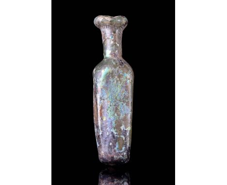 Ca. 400-500 AD A miniature late Roman flask made of light green glass with a tubular everted rim, cylindrical neck with const