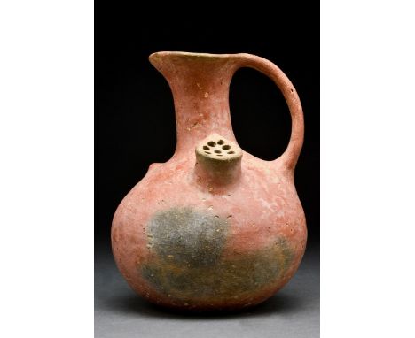 Cyprys, Middle Cypriot, Ca.1900-1600 BC A terracotta strainer vessel used in the fermentation of beer; with bulbous base, lon