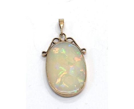 Large opal pendant opal measures approx 36mm by 24mm set in gold mounted pendant