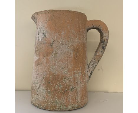 A terracotta vintage jug, age related wear, approximate measurements: Height 12 inches, Width inc handle and spout 10.5 inche
