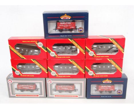 Box containing 17 wagons by mixed makers, 12x Hornby R102 NCB mineral wagon, 2x Bachmann 'Shelton' PO, 2x Dapol 'Parkhouse' P
