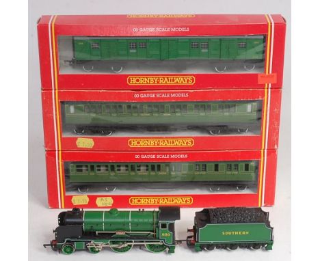 Boxed Hornby R162 and R163 Maunsell olive green coaches (NM-BNM), R178 malachite bogie luggage van (NM-BNM), sold with unboxe