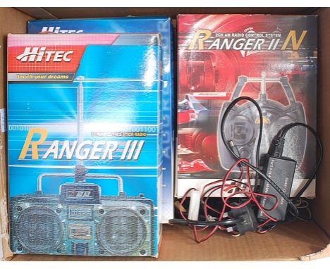 Three radio control units - Hitec 3 channel FM 'Aggressor', Hitec 2 channel AM Ranger II, Hitec 3 channel FM 2 stick Ranger I