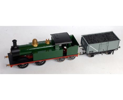 Gauge 1 0-4-0 tank loco by Dee with can motor coupled to a Bachmann China Mineral wagon (with coal) containing electric contr