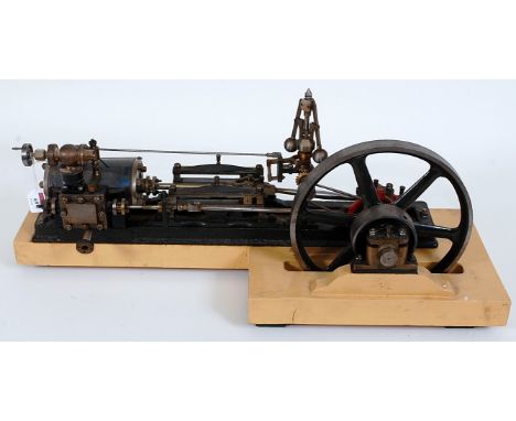 Pre-war single cylinder outward bearing horizontal engine. 2'' bore x 4'' stroke cylinder with 2 hand operated drain cocks dr