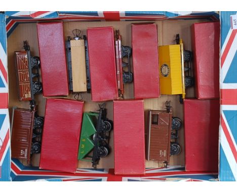 Large tray containing 7 Hornby boxed post-war wagons including LMS goods LMS hopper, LMS wagon with sheet rail, No. 1 timber,