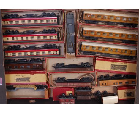 A collection of post-war Trix Twin rolling stock, 3 scale length teak coaches (G-BG), 1 shorter teak, 1 shorter LMS dining ca