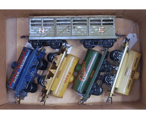 Tray of four Hornby pre-war tankers, Redline-Glico, Esso (buff), Castrol, BP (cream), all (G) with NE No. 2 cattle truck (G) 