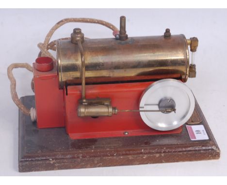 A National Playthings electrically powered working model of a stationary steam plant, comprising of tin housed boiler with si