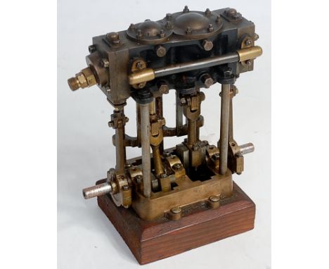 A very well engineered miniature stationary steam compound engine, comprising twin cylinders, fitted with slip eccentric and 