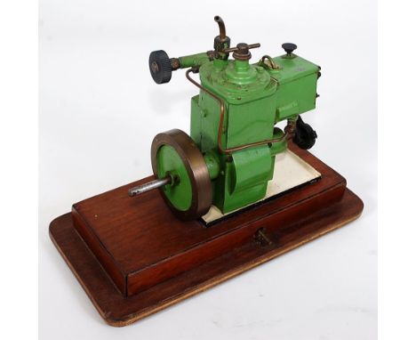 A small vertical marine type steam/air engine single cylinder approx 1'' bore, totally enclosed piston and crankshaft driving