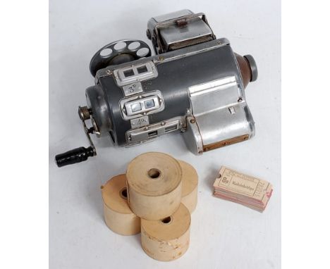 A TIM Limited (Ticket Issue Machines) cased bus conductor's ticket machine with a quantity of various unused ticket reels, an