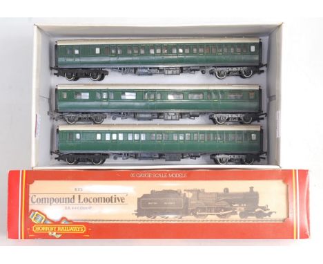 Boxed Hornby R175 British Railways black class 4P Compound 4-4-0 engine and tender (G-BG) and sold with 3 Triang SR green cor