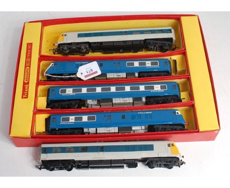 A Triang RS 52 train set box base containing 3 car Blue Pullman train (G) and a 2 car later blue/grey Pullman train with yell