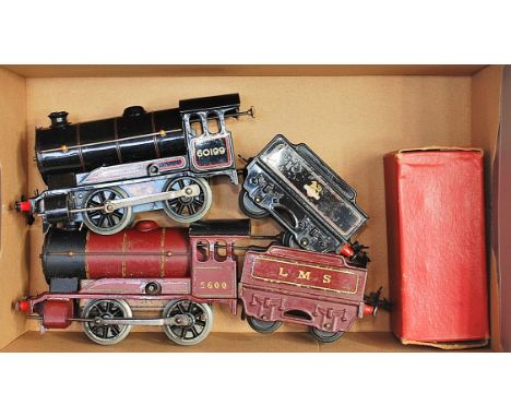 Hornby No. 501 LMS red clockwork engine No. 5600 with a pre-war LMS tender (F) and a 1954-61 BR black type 50 loco No. 60199 