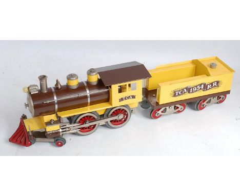 McCoy Manufacturing USA TCA 1954 standard gauge 4-4-0 loco and tender, yellow and brown, metal fatigue to piston/cylinders