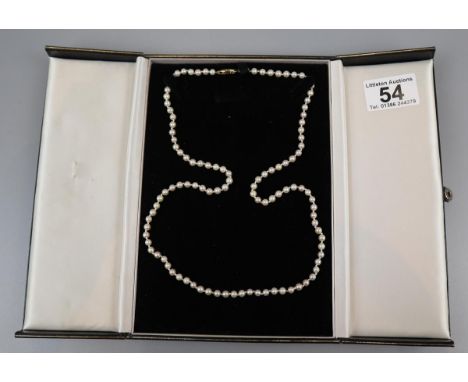 Cultured pearl necklace with gold clasps