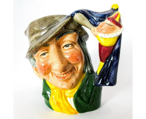 Brown hat; green coat; yellow scarf.Coming to England in the 17th century by way of Italy and France, the Punch and Judy pupp