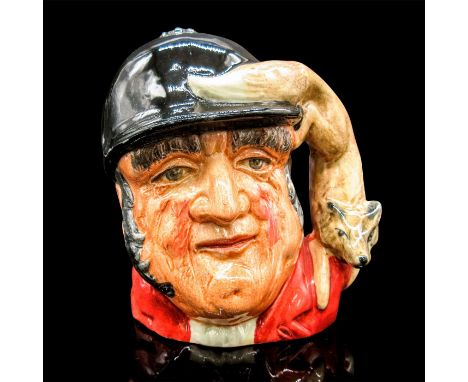 Glazed, hand painted ceramic. The British huntsman is in a red jacket and black cap. The handle is a fox.Royal Doulton backst