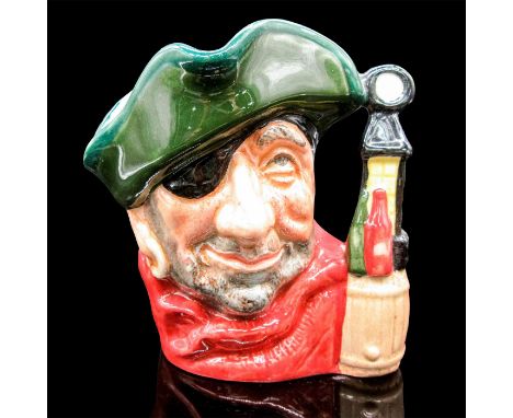 Glazed, hand painted ceramic. The smuggler is in a green hat, red scarf, and black eyepatch. The handle is lantern and bottle
