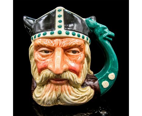 Glazed, hand painted ceramic. The Viking is in a black, green and brown coloration. The handle is green prow of a Viking long