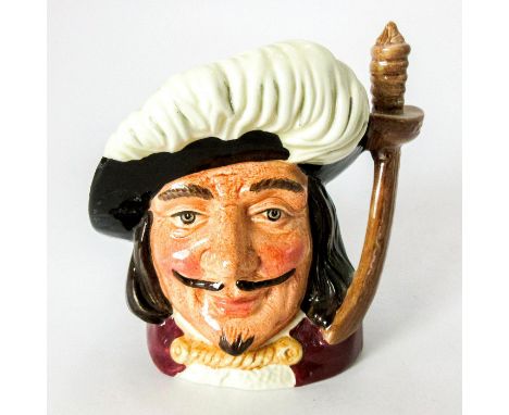 Variation One. Black hat; red cloak; black hair and moustache.One of the much-loved three musketeers in the 1844 novel by Ale