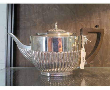 A silver tea pot, gadrooned decoration, W Hutton &amp; Sons Ltd, Sheffield, 1923, 14 cm high, 503g total weight 