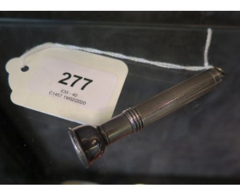 A silver cigar piercer, engine turned,  Birmingham 1955, 7 cm long 