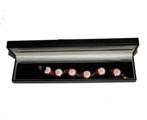A silver bracelet with six red and white enamel roundels, boxed 