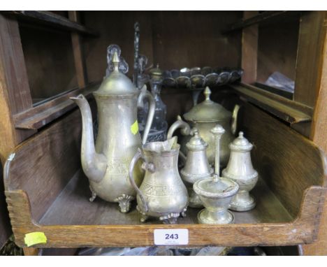 A collection of silver plate, including cruet stand with five bottles, a salt, pepper and mustard cruet, a cake stand and a m