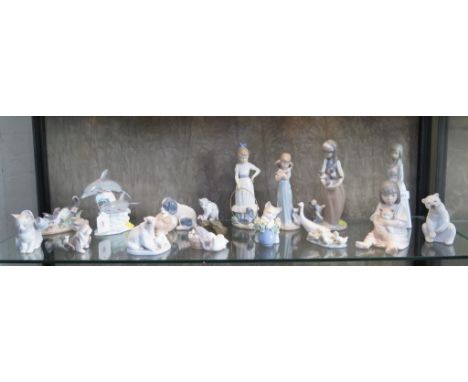 A collection of Lladro and Nao figures of children, polar bears, kittens and geese, largest 25 cm high, and a Leonardo Collec