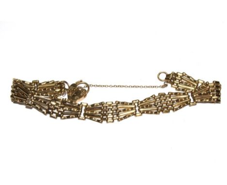 A gold gate bracelet, as found 