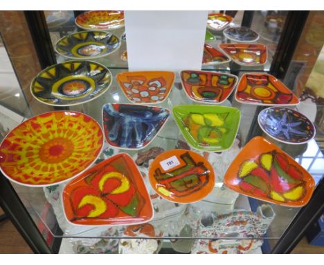 Seven Poole Pottery Dephis trapezoid dishes, and four circular Delphis dishes, 12.5 and 20 cm diameter, all with mongram mark