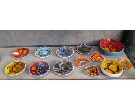 Seven Poole Pottery Delphis circular dishes, 13 cm diameter, each with painters mark, (two cracked), three trapezoid dishes, 