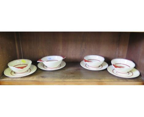 A vintage Suzie Cooper set of four art deco two handle bowls and saucers with polka dot and striped design Crown Works stamp 