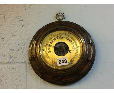 An oak cased barometer