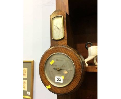 An oak cased barometer
