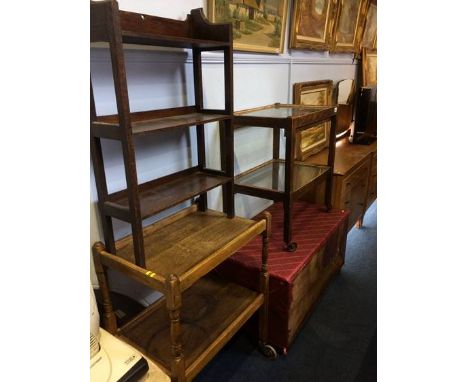 Two tea trolleys, a pine trunk and an oak book shelf