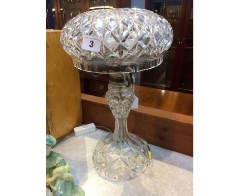 A cut glass lamp